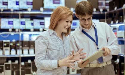 salesman-showing-tablet-to-woman-in-store.jpg